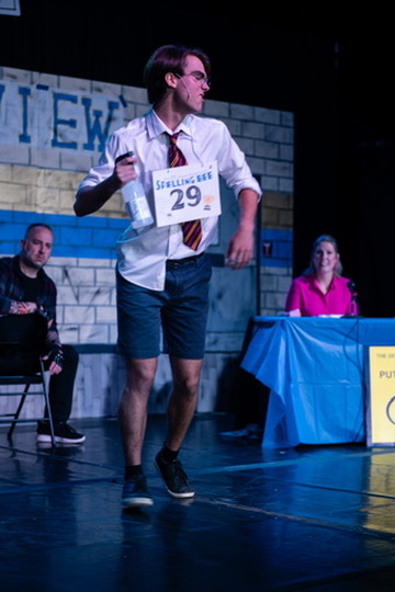 Richard Jordan mid-song with his number 29 card before the judges in Putnam County Spelling Bee