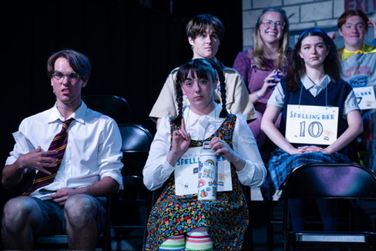 Richard Jordan seated among the spellers reacting during Putnam County Spelling Bee