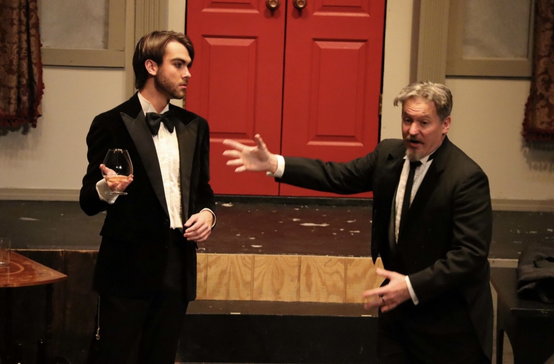Richard Jordan reacting as another actor gestures in CLUE