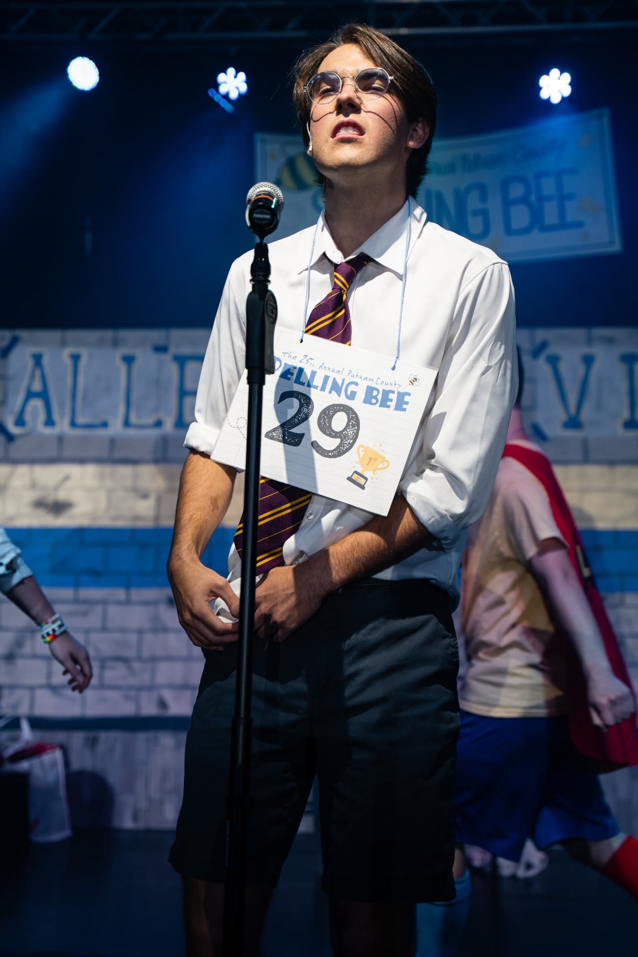 Richard Jordan standing at the microphone with his number 29 card during Putnam County Spelling Bee