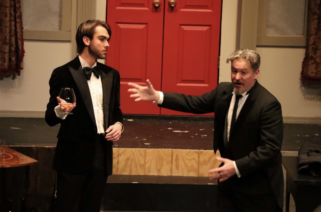 Richard Jordan in a tuxedo opposite another actor in CLUE