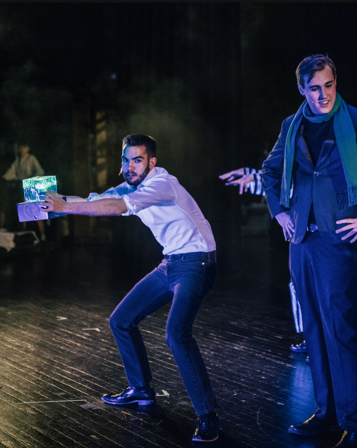 Richard Jordan reaching out with a glowing box mid-scene