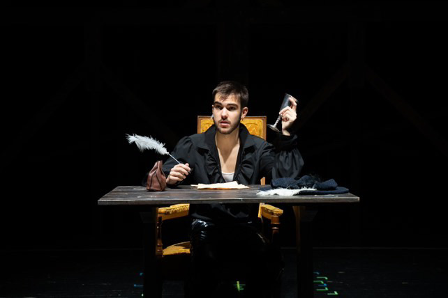 Richard Jordan as William Shakespeare at a desk with a quill