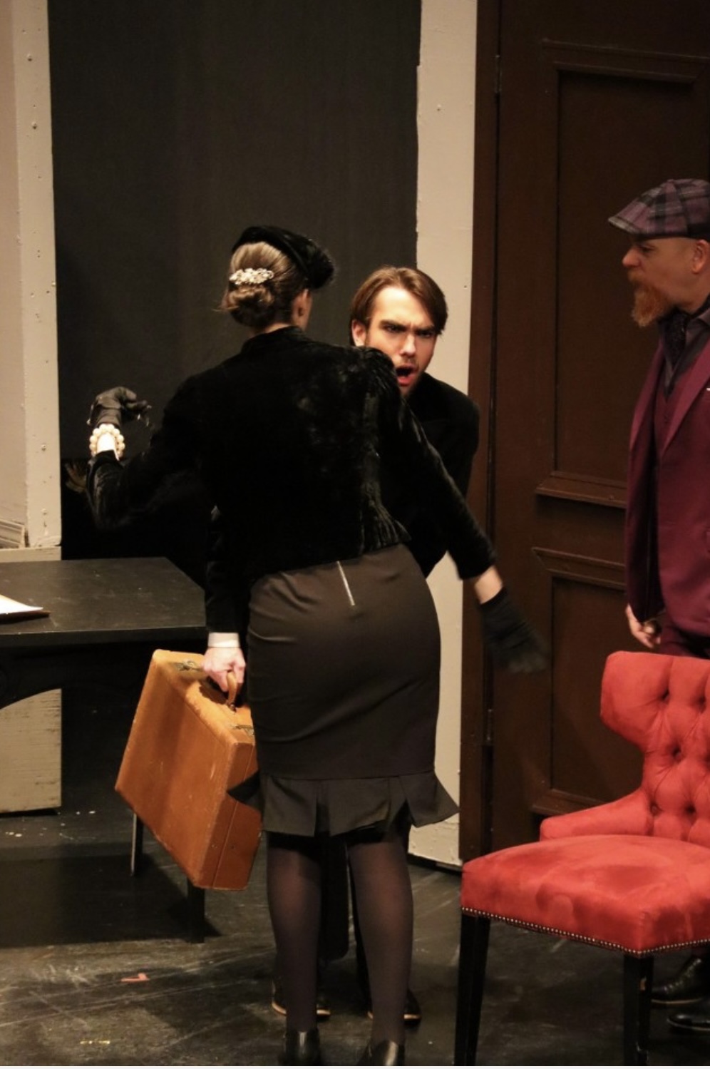 Richard Jordan in a startled reaction with two other actors on stage