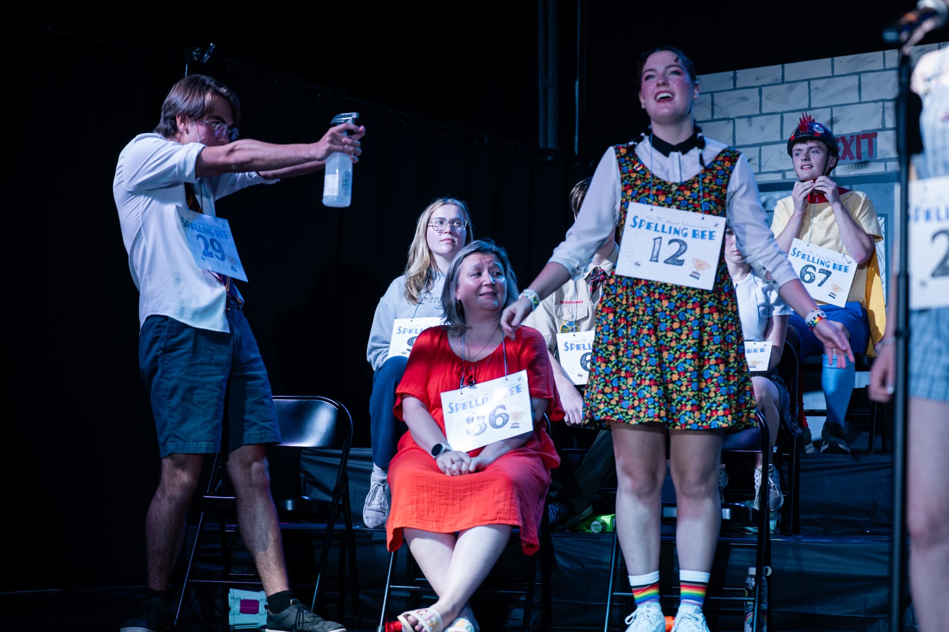 Richard Jordan spraying water over the spellers during Putnam County Spelling Bee