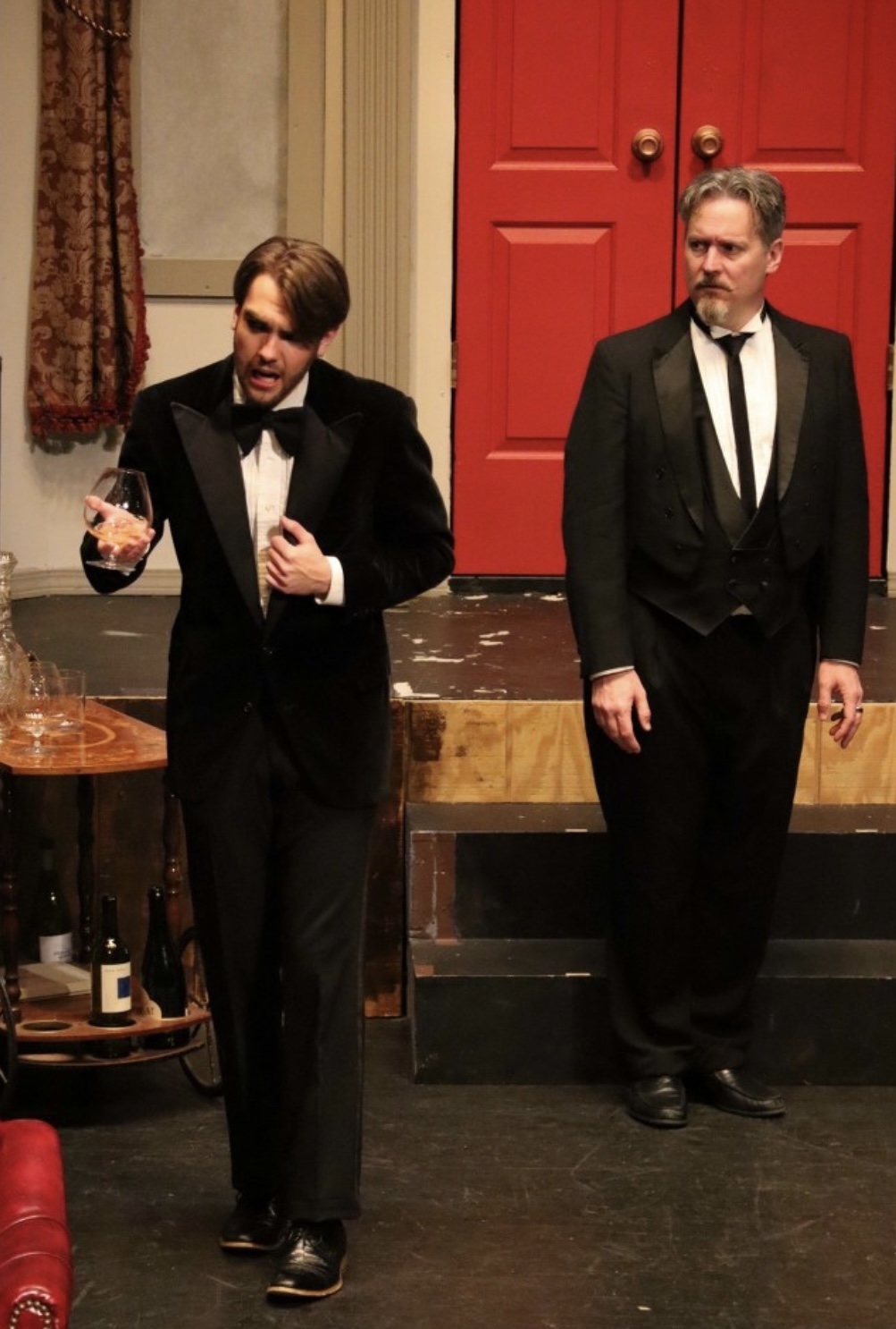 Richard Jordan in a tuxedo mid-scene in CLUE