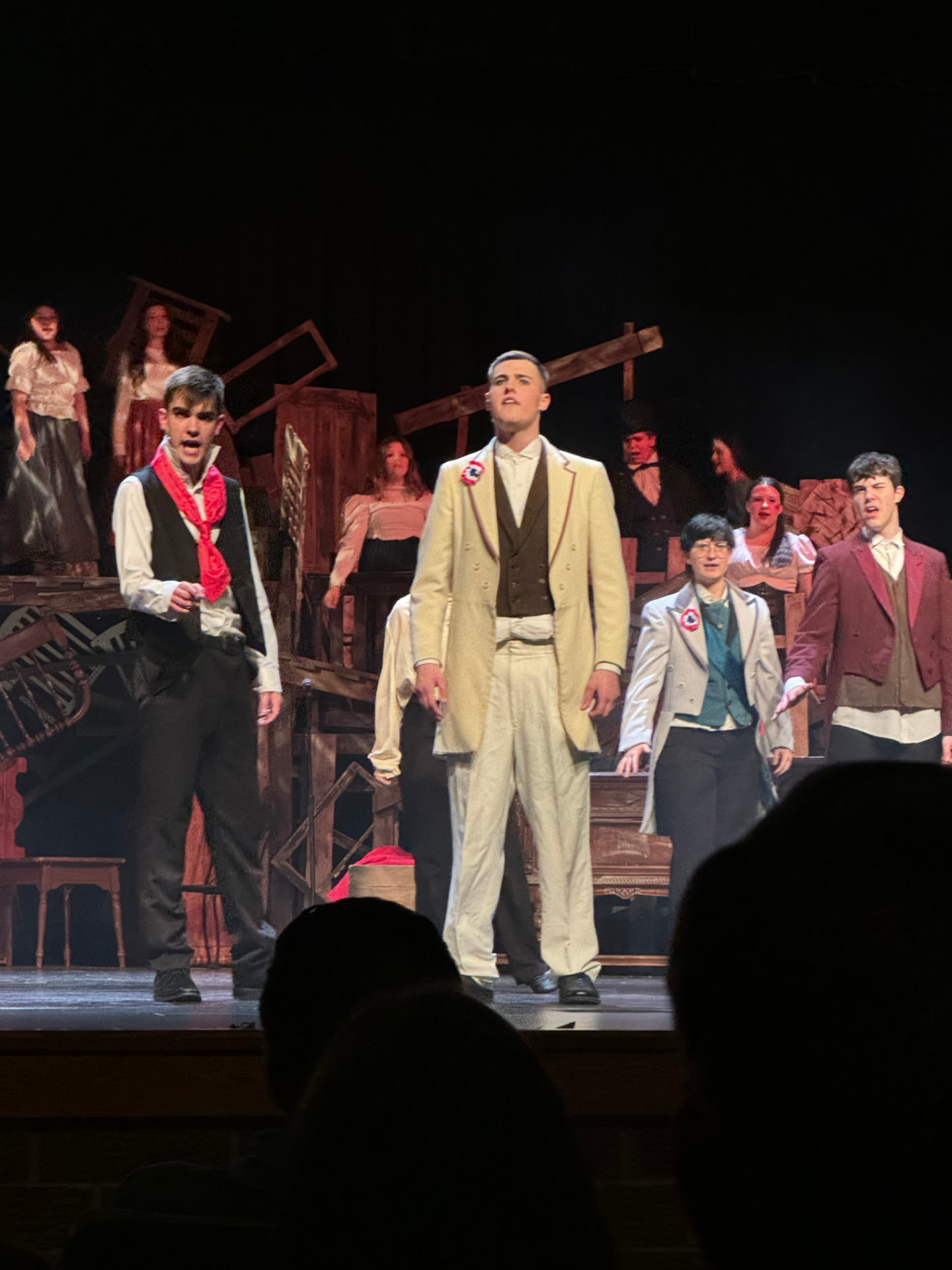 Richard Jordan center stage with the ensemble in Les Misérables